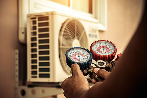 Professional Air Conditioning Service technician working in Milton, MA